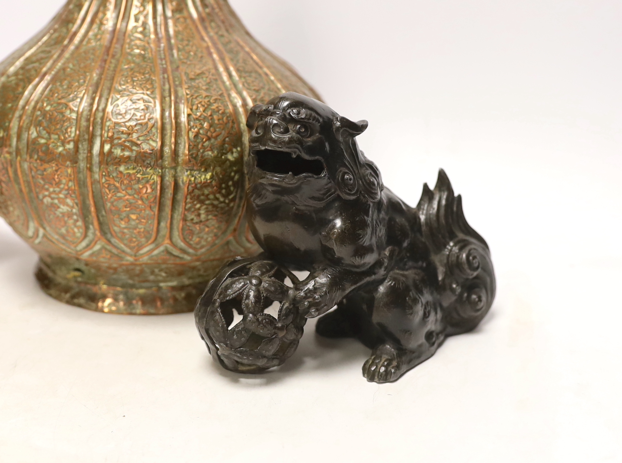 A Persian copper converted lamp, Chinese dog of Fo and a box and cover, tallest 34cm